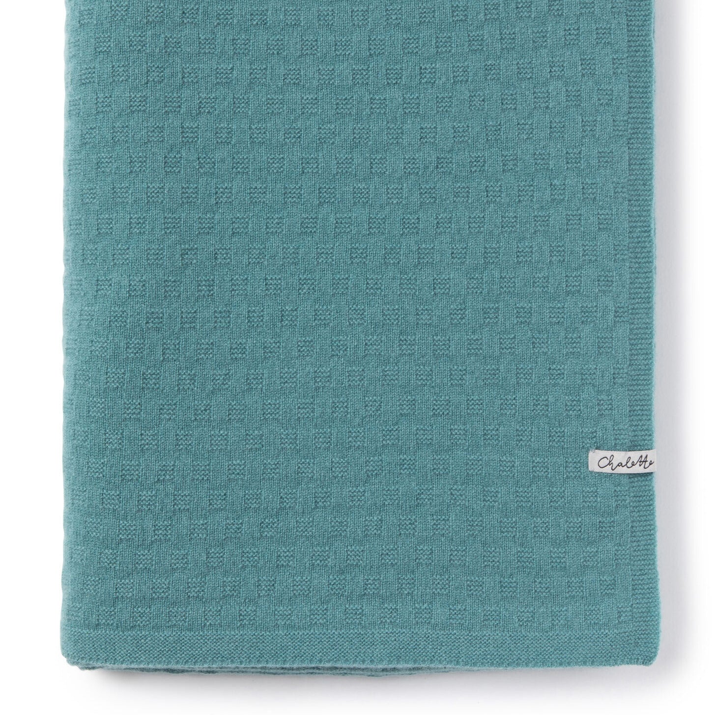 Gefaltete Babydecke mit strukturiertem Waffelmuster Blau, mit Chalette-Etikett